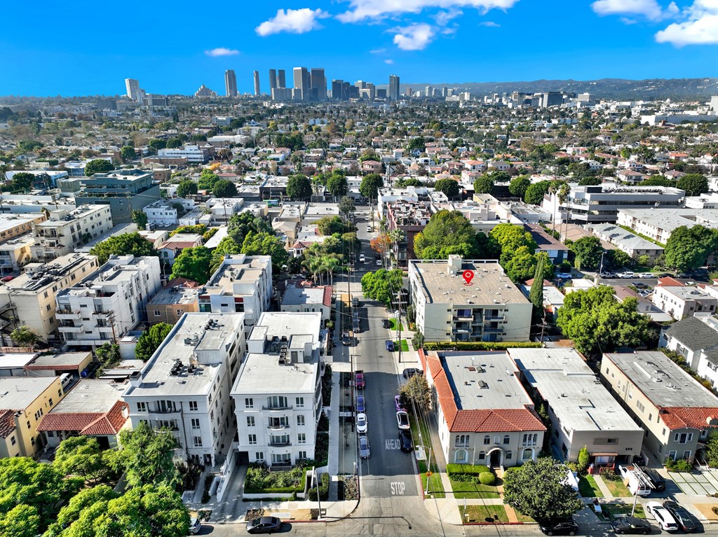A cityscape with buildings and a clear sky at Wooster Encore Apartments, Los Angeles, California