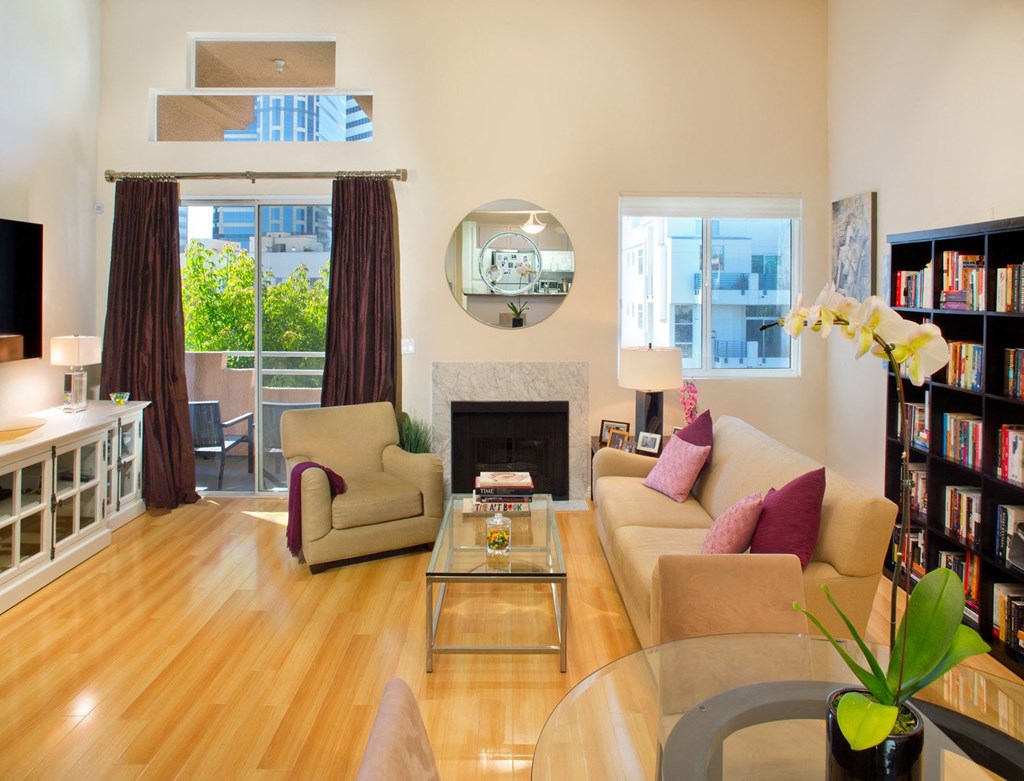 Apartment living room with fireplace and private balcony