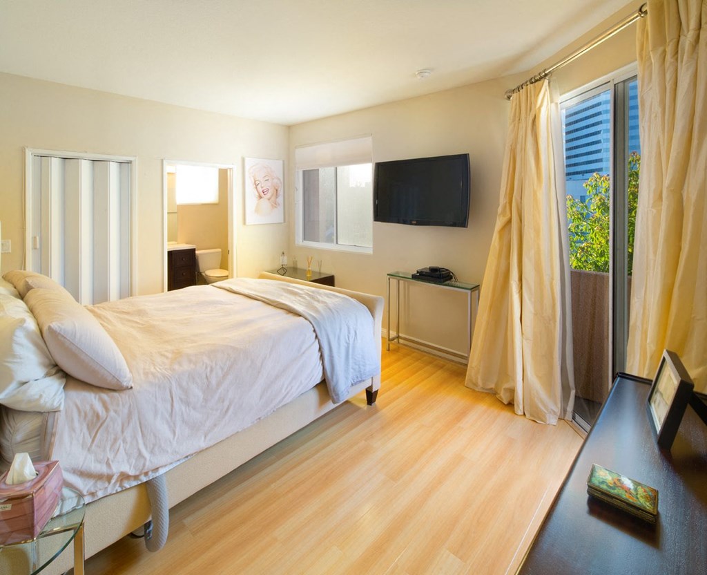 Apartment bedroom with bathroom and private balcony