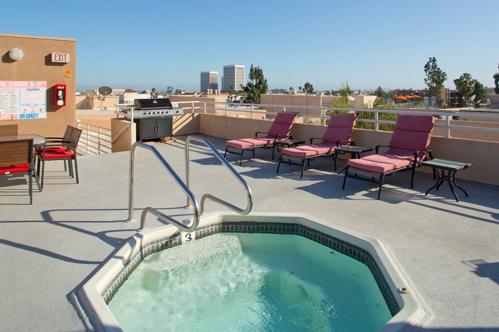 10910 Wellworth Community jacuzzi and BBQ/grill area with outdoor furniture