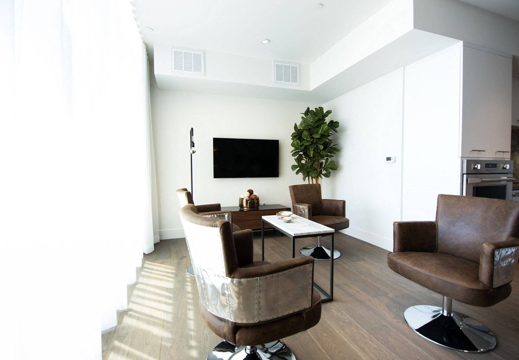 Community lounge with furniture and television