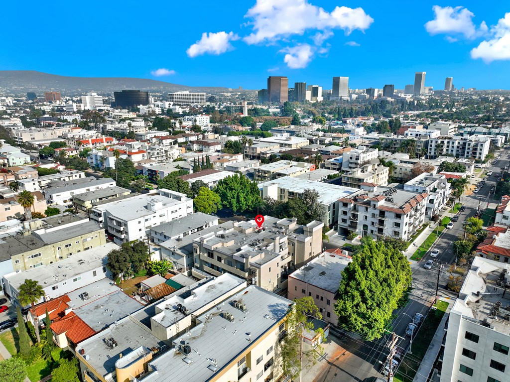 A cityscape with buildings and a clear sky.