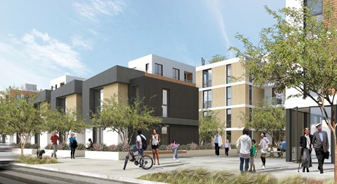 A modern building with people walking around it.