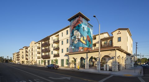 a mural on the side of a building on a city street