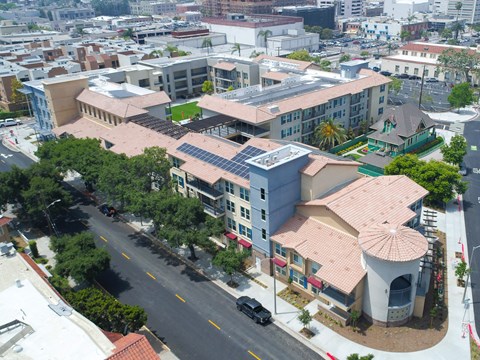 an aerial view of a city with buildings and a street