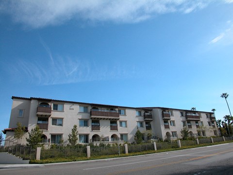 an apartment building on the side of a street