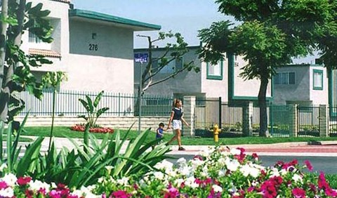 a woman and a child walking down the street