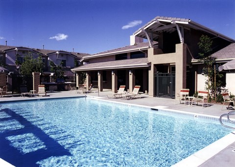 a swimming pool in front of a house