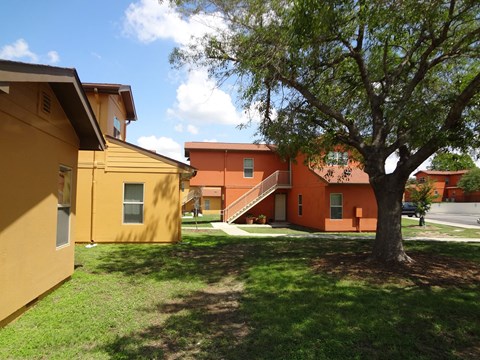 a view of a group of houses in a yard