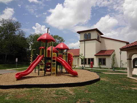 a playground with a building in the background