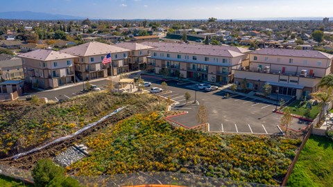 an aerial view of a building with a parking lot