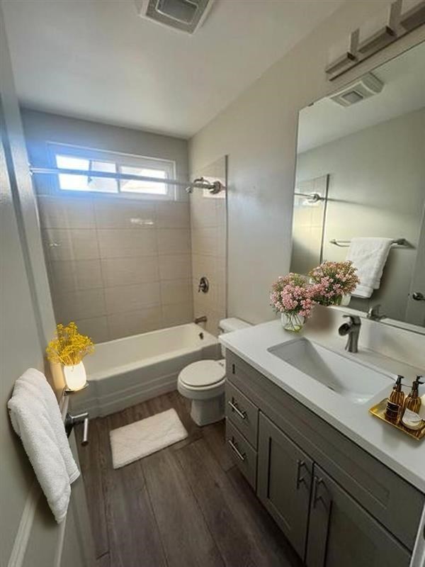 A bathroom with a white towel hanging on the wall.