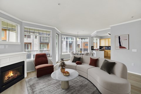 A modern living room with a fireplace and a couch.