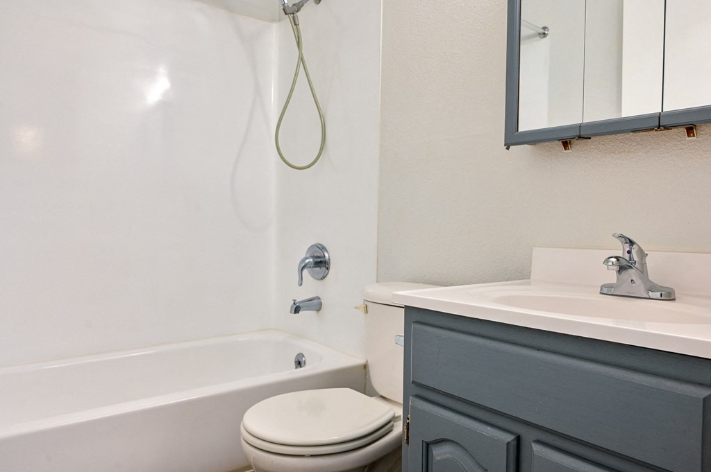 Bright Bathroom with bath tub at Kentwood Apartments, Kent, WA