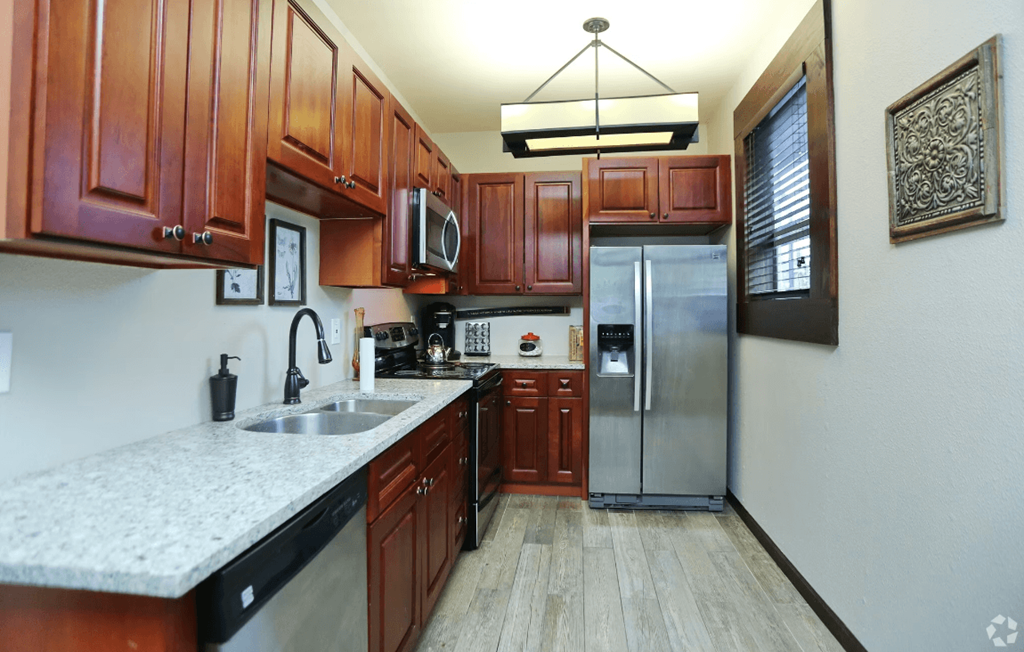 Modern Kitchen With Stainless Steel Appliances And Double Door Refrigerators at Sunset Park Apartments, Seattle