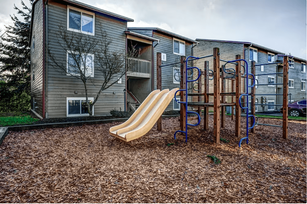 Playground in front of an apartment building at Sunset Park Apartments, Washington