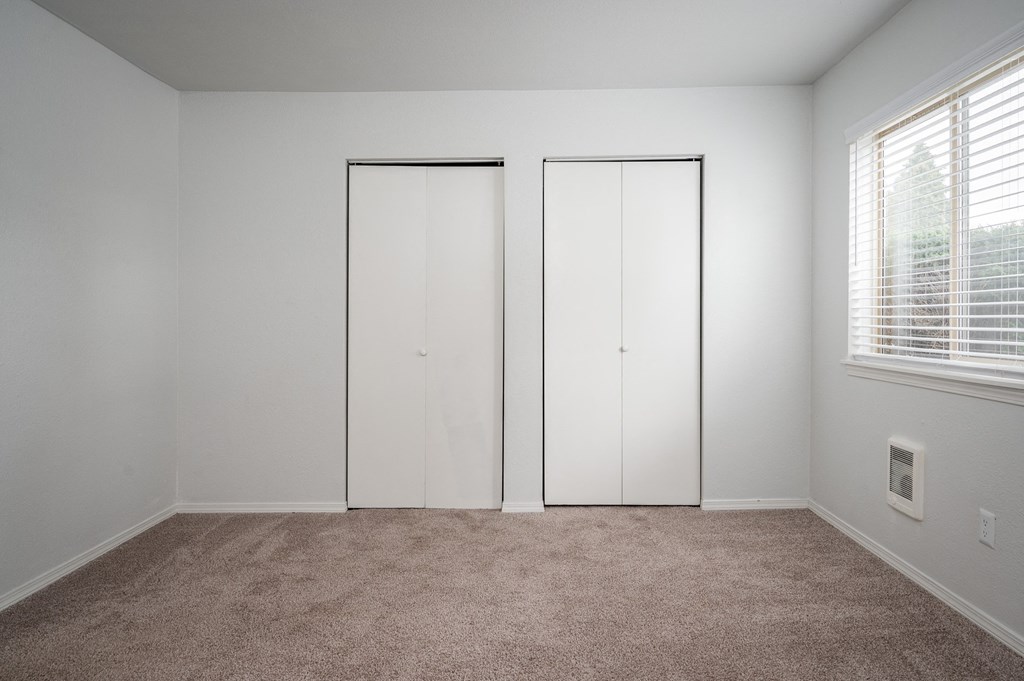 Bedroom With Expansive Windows at Kentwood Apartments, Kent, WA, 98031