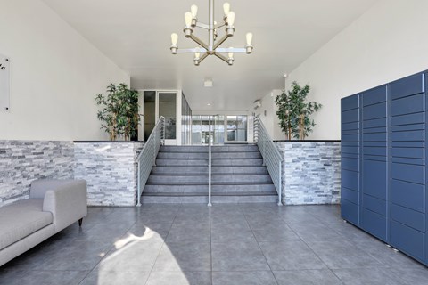 A large, open space with a staircase leading to a second floor. at Chateau La Fayette, Los Angeles, CA, 90057