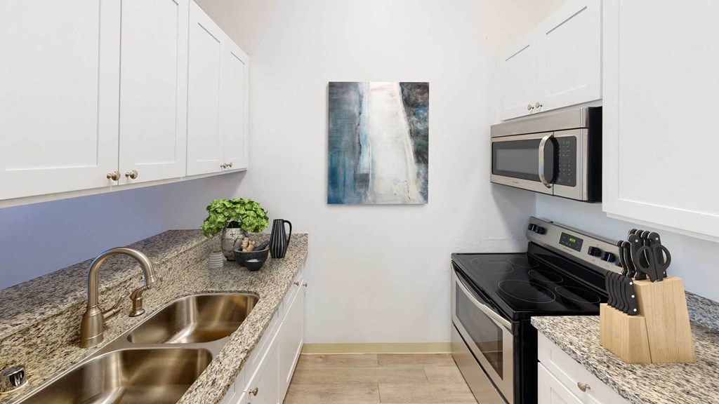 Updated Kitchen With Black Appliances at Oxnard Plaza, North Hollywood