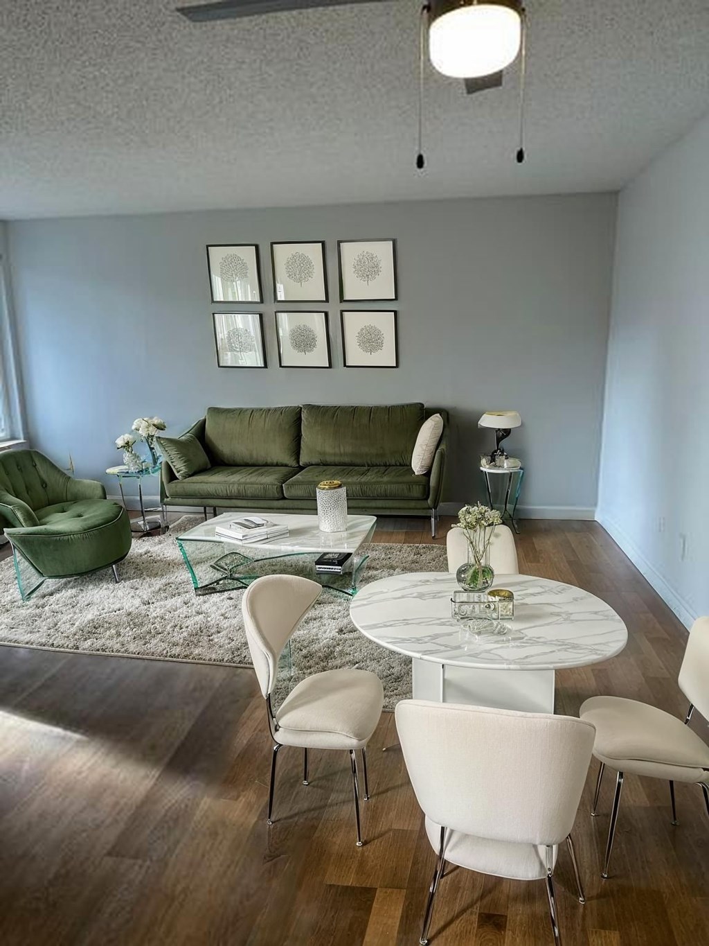 Spacious Living Room With Plank Flooring at Capri Apartments, Mountlake Terrace, WA