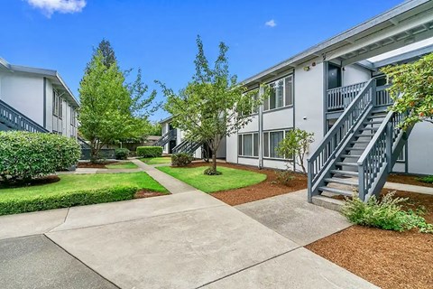 A sunny day at a residential complex with a clear blue sky.