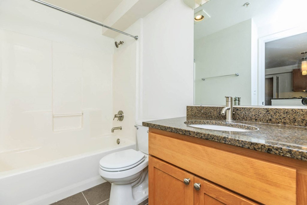 a bathroom with a sink toilet and a mirror  at Delano, Washington