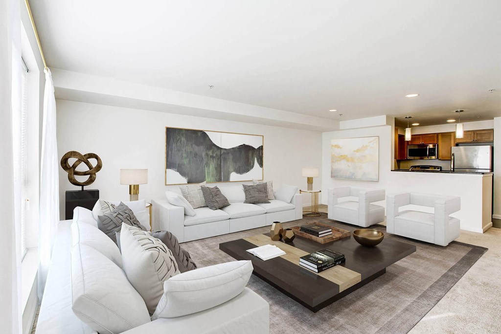 a living room with white couches and a coffee table  at Delano, Redmond, 98052