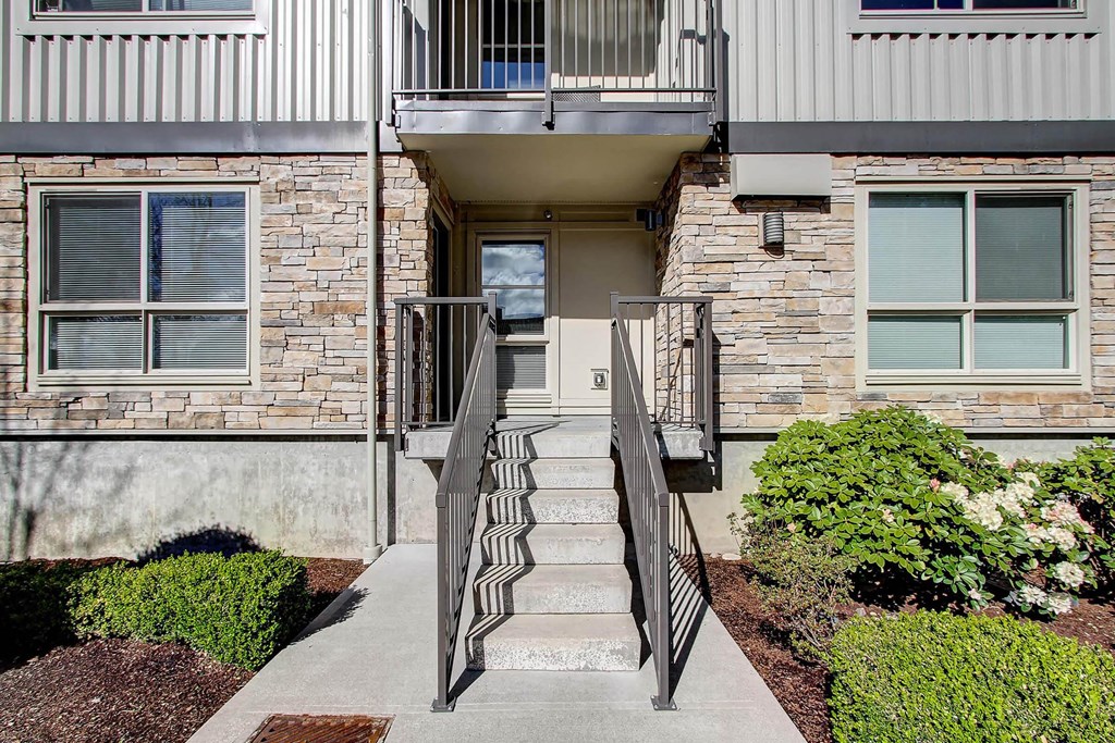 our apartments offer a staircase to the front door of the building at Delano, Redmond, WA 98052