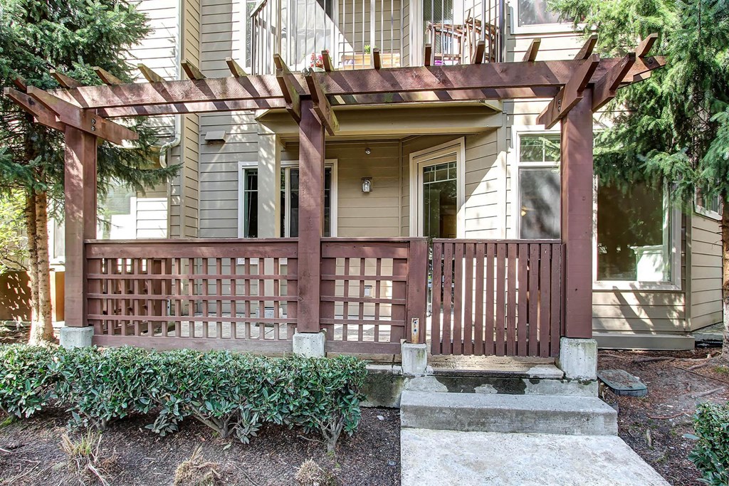 the front porch of a house with a wooden deck at Delano, Redmond, 98052