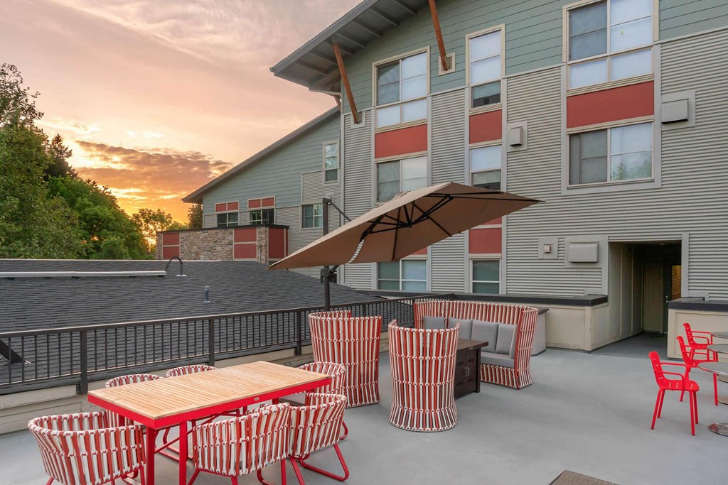 our apartments have a large patio with tables and chairs  at Delano, Redmond Washington