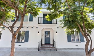 Property Front Entrance with Trees at Barton Apartments in Hollywood, California