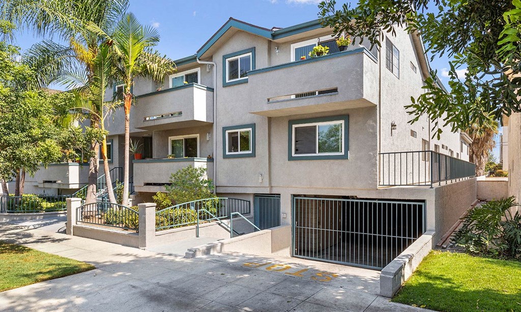 Property Exterior Front Entrance with Garage at Elmwood Gardens Apartments in Burbank, CA
