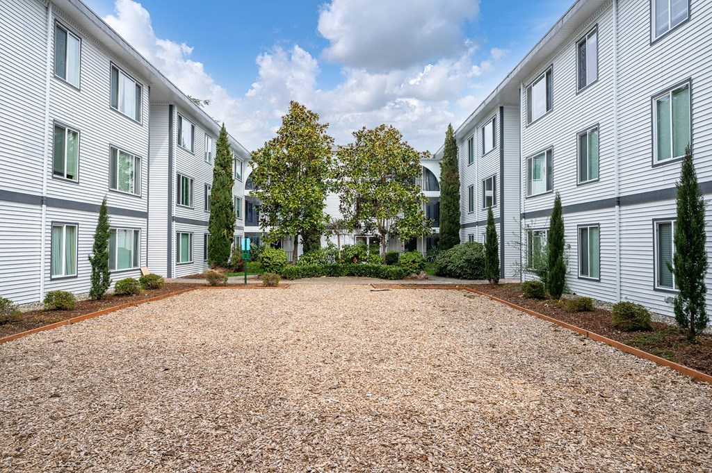 Courtyard with trees and gravel at The Ridge at Bellevue, Bellevue, WA
