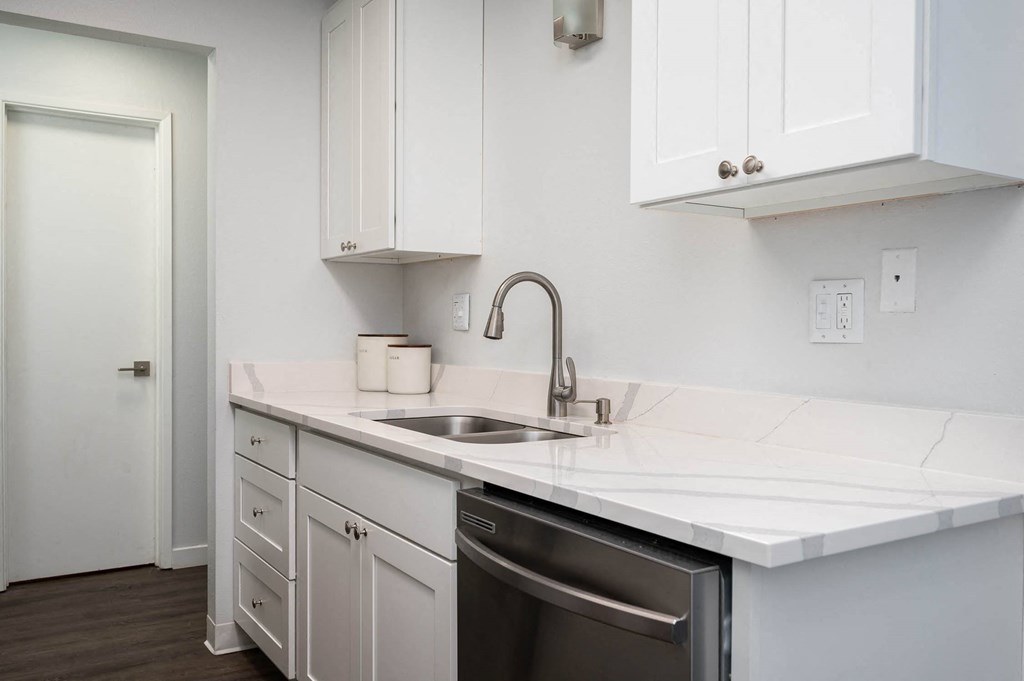 Kitchen with white counter tops and a sink at The Ridge at Bellevue, Bellevue, WA, 98005