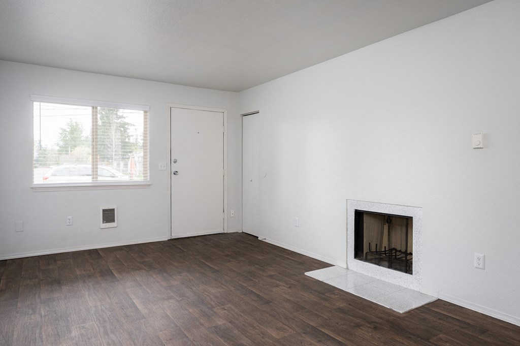 Living Room With Standard Fireplace at Kentwood Apartments, Kent, Washington