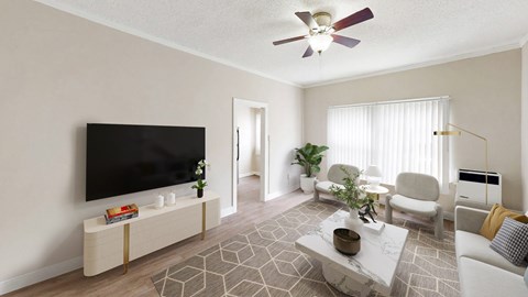 A living room with a television, a couch, a chair, a table, and a plant.