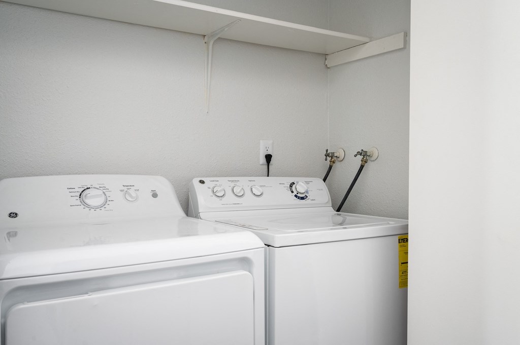 Laundry room with washer and dryer at Kentwood Apartments, Kent, WA, 98031