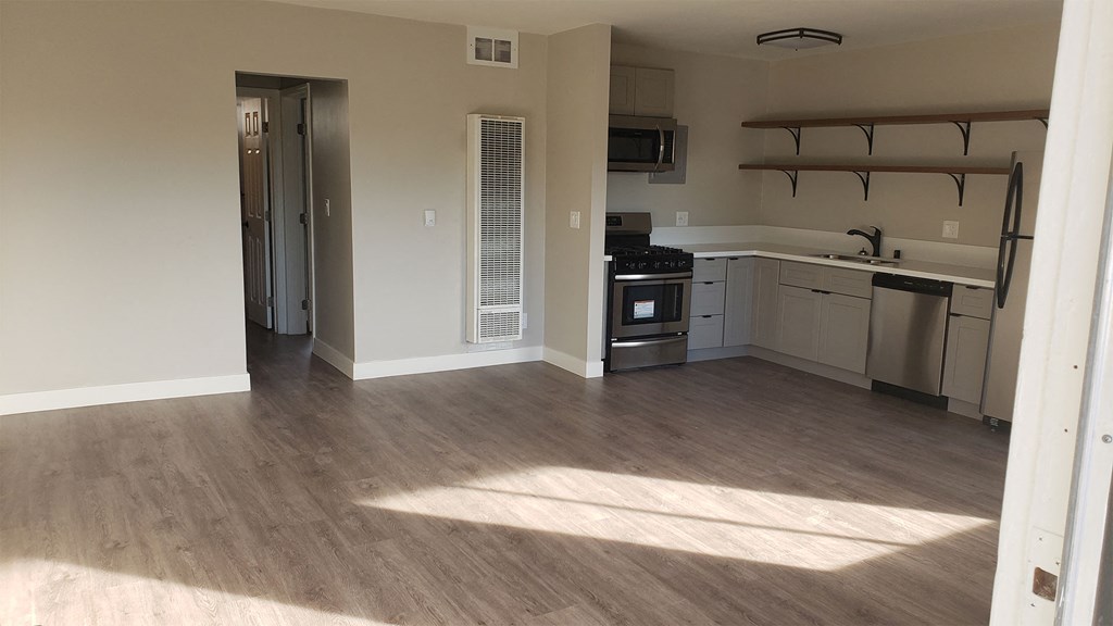 Living Room Space Near Kitchen and Dining Are at Wilson Apartments in Glendale, CA
