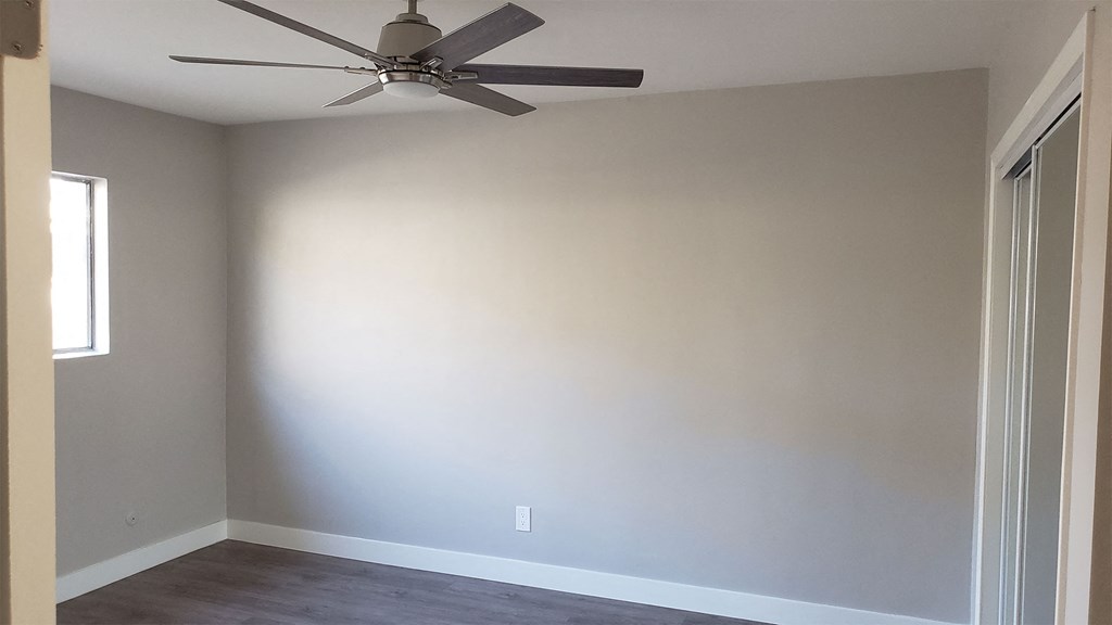 Bedroom with Window, Ceiling Fan, Hardwood Flooring at Wilson Apartments in Glendale, CA