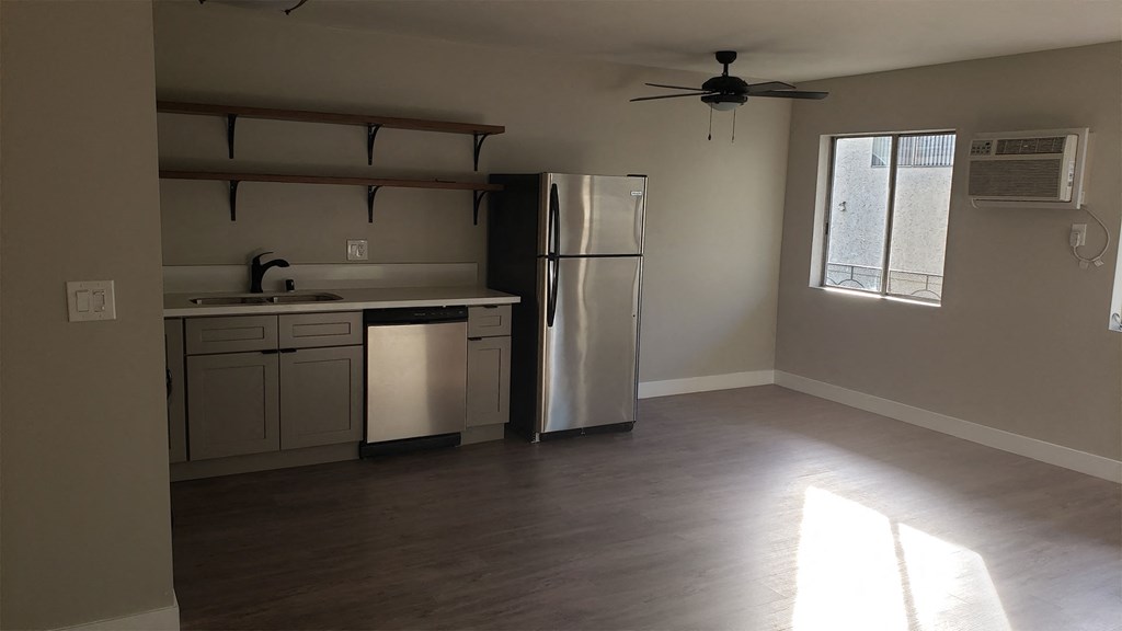 Kitchen Area With Ceiling Fan, Hardwood Flooring, Stainless Steel Appliances at Wilson Apartments in Glendale, CA