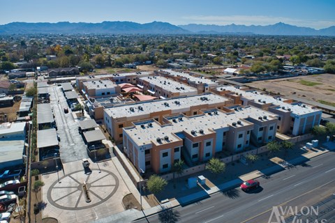 Avalon Village is a large, well-organized community with a central fountain and a variety of buildings.