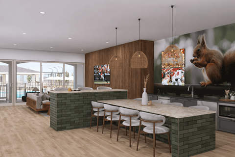 A modern kitchen with a wooden island and a squirrel decoration.