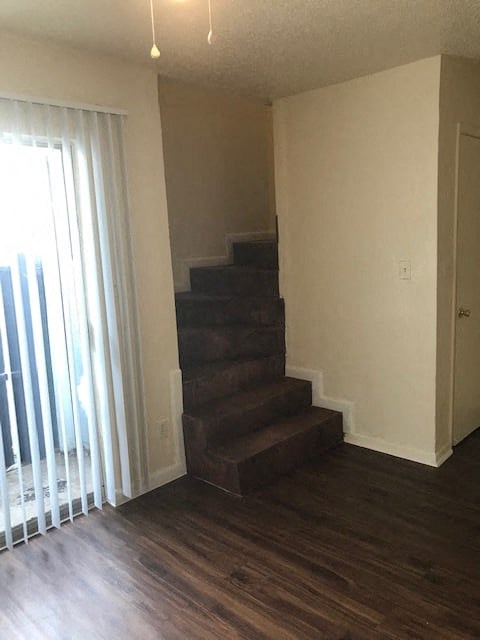 a room with a staircase and a window