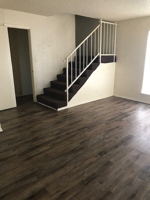 an empty room with a staircase in it