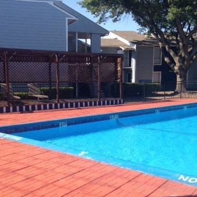 a swimming pool with a fence around it