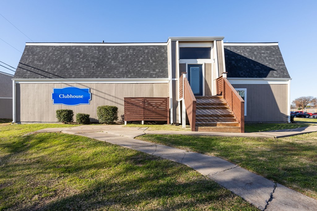 A building with a blue sign that says "Clubhouse" is shown.