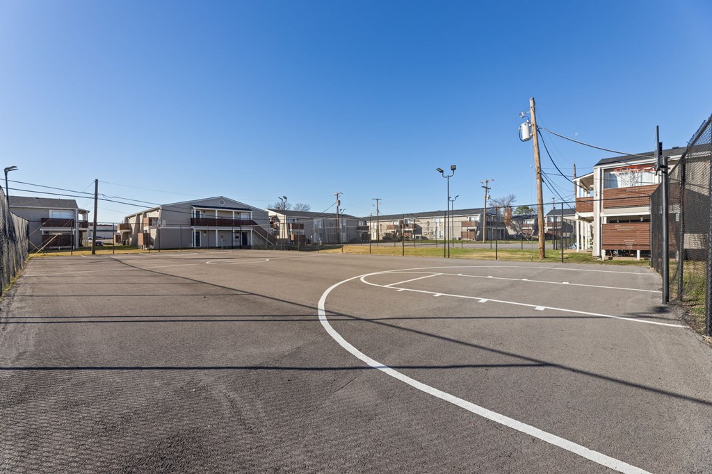 A parking lot with a clear blue sky above.