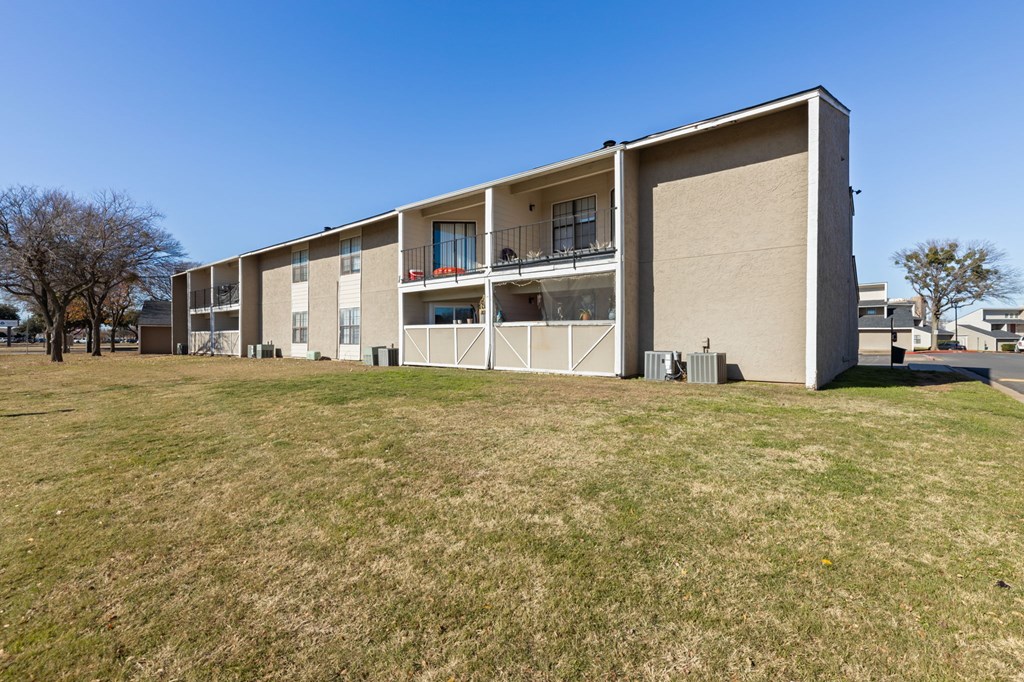 A large building with a balcony on the second floor.