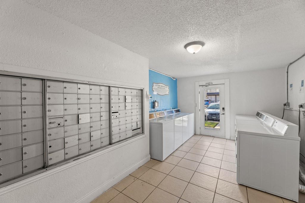 A laundry room with a washer and dryer.
