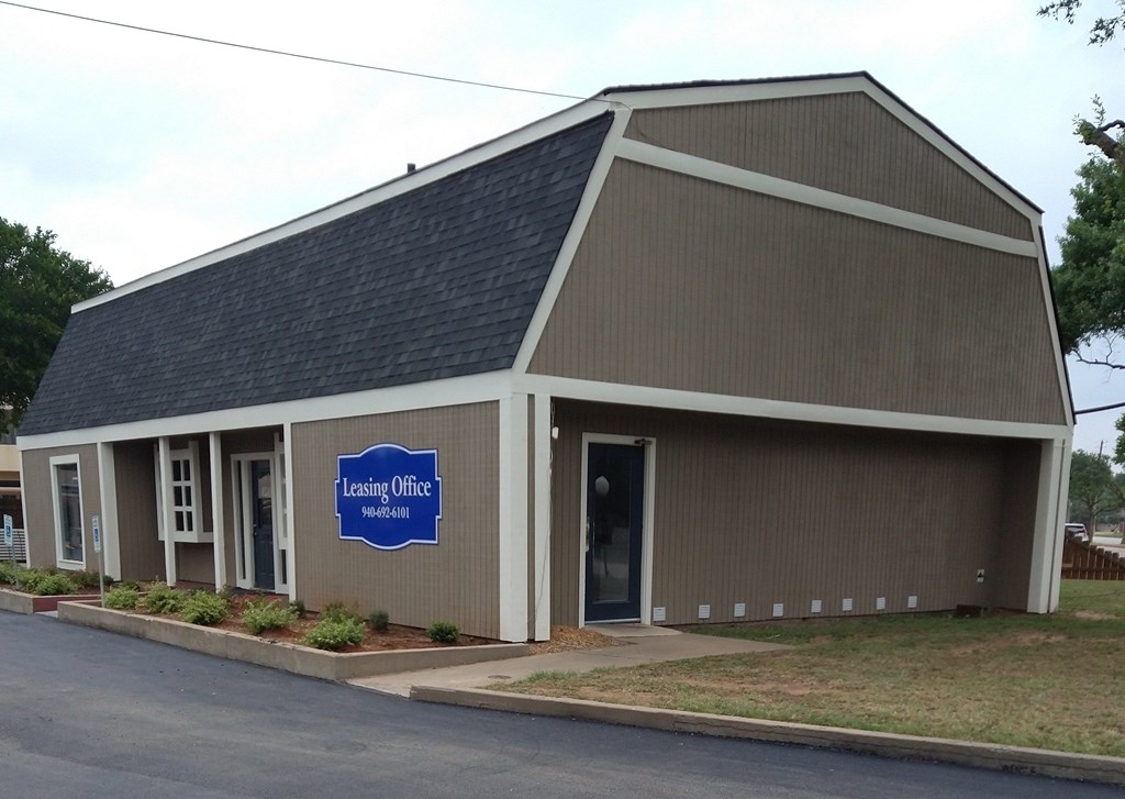 A building with a sign that says Leasing Office Northampton.
